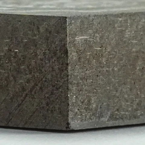 Edge of a dark HDF board.